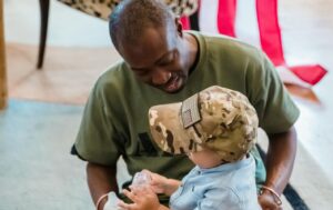 A recently divorced military member plays with his child