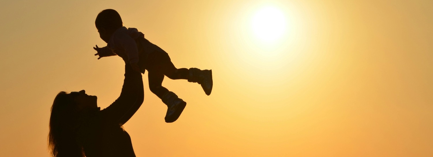 a woman plays with her child after a military divorce